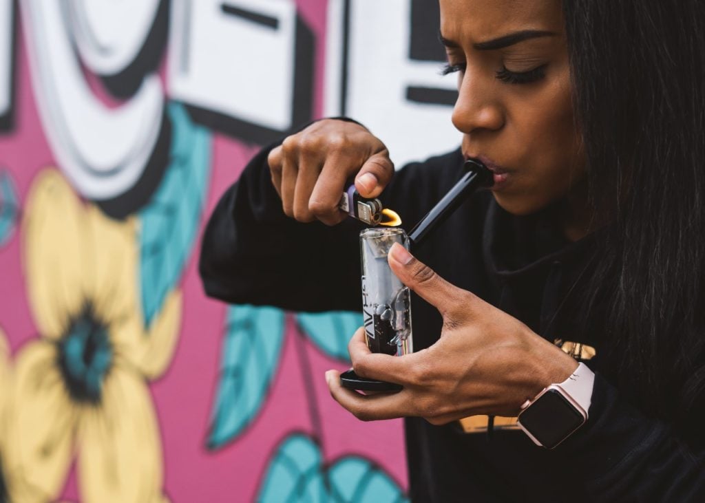 woman consuming cannabis