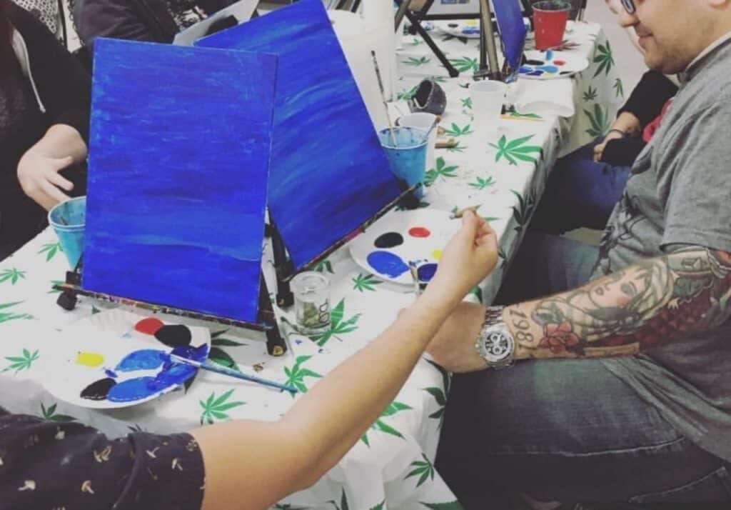 people attending a puff pass and paint class